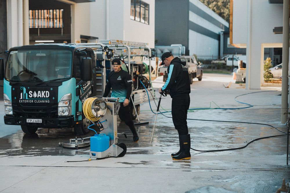 A Commercial Outdoor Area Undergoing Pressure Cleaning Service