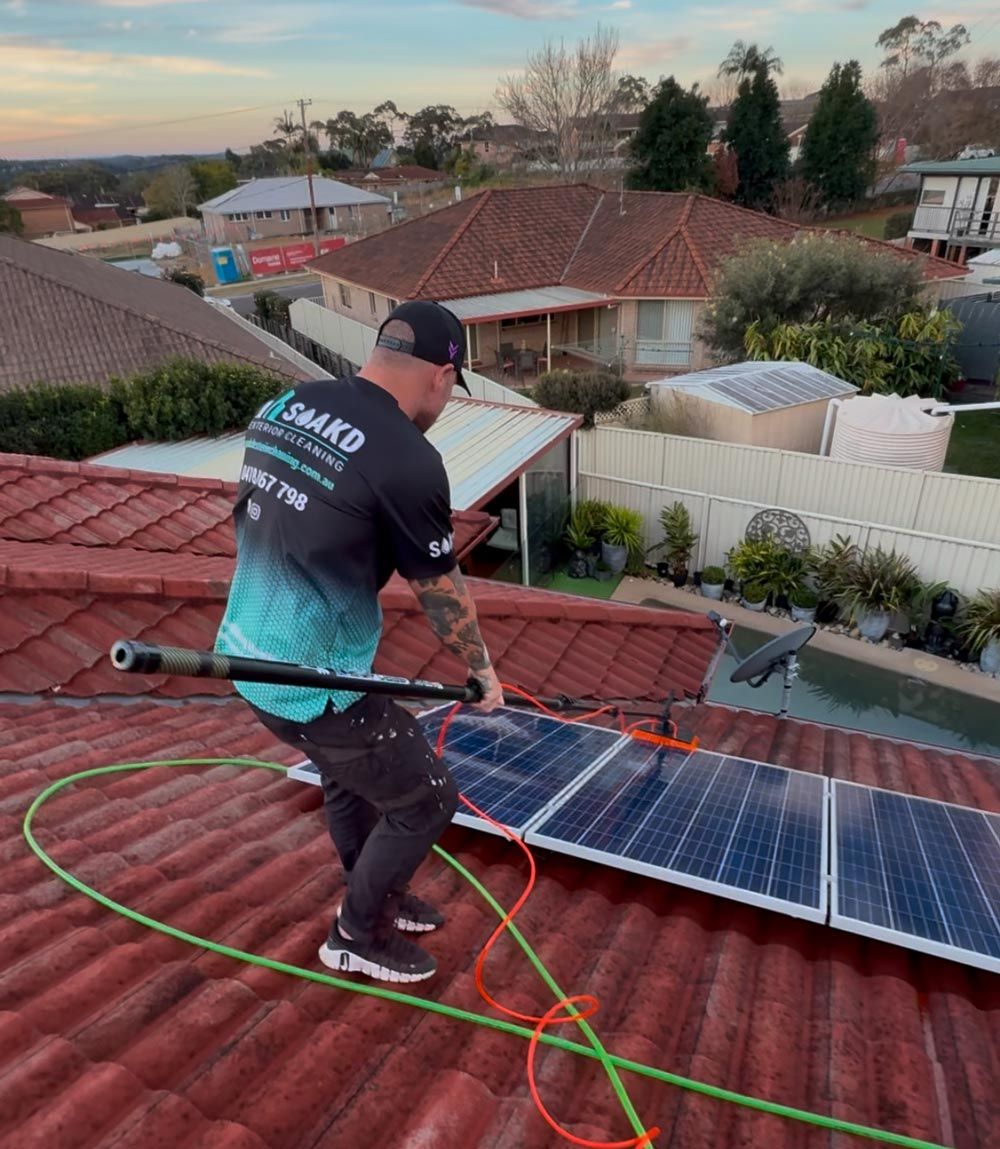 A Professional Cleaning A Roof In Central Coast
