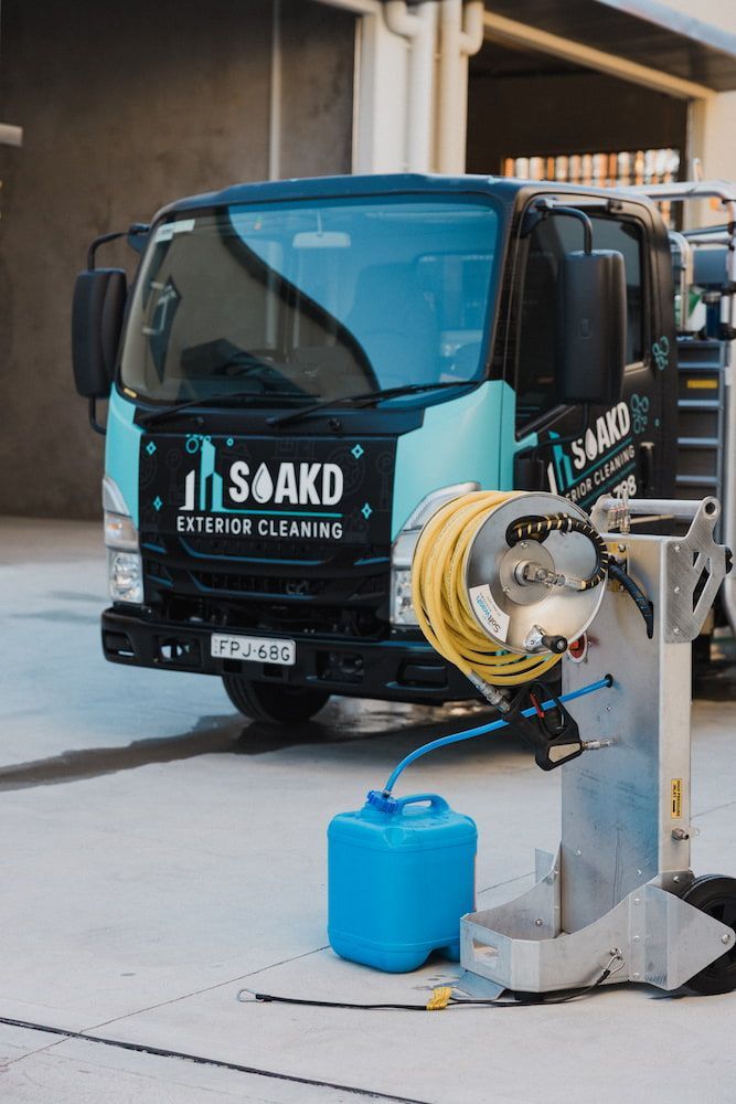A Teal and Black Cleaning Truck — SOAKD Exterior Cleaning in Wamberal, NSW