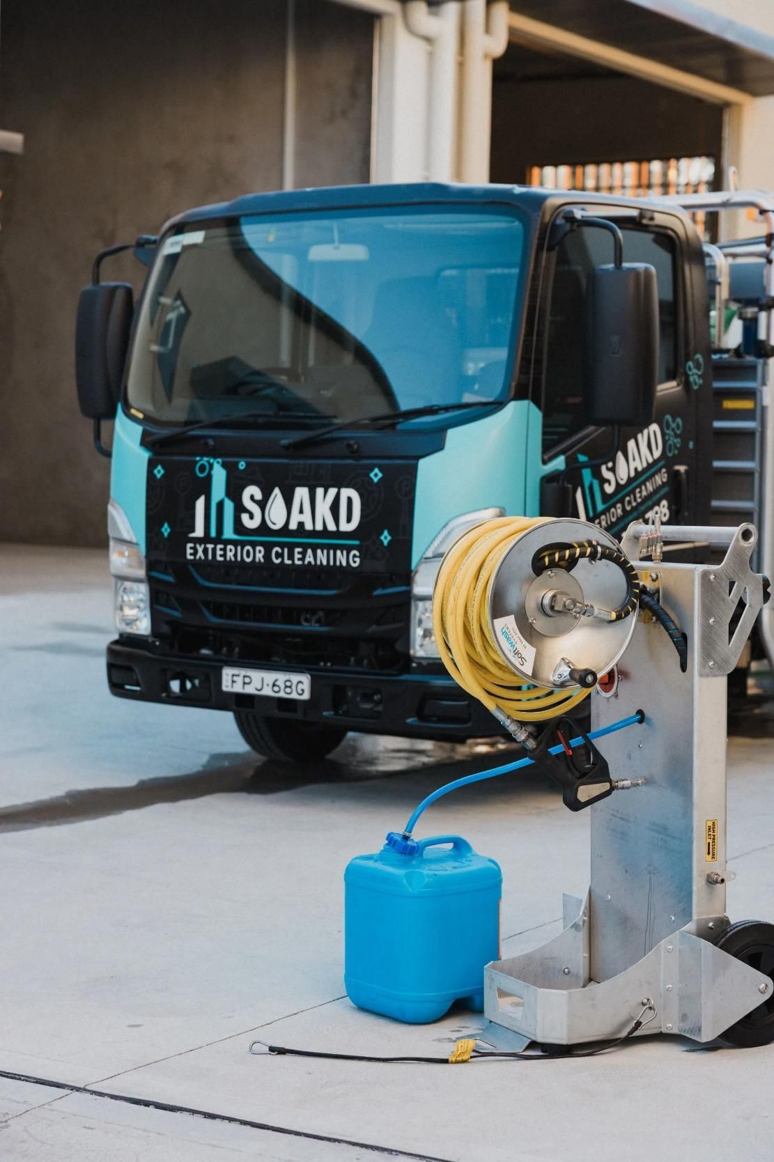 a Blue and Black Cleaning Truck Parked Outside — SOAKD Exterior Cleaning in Kariong, NSW