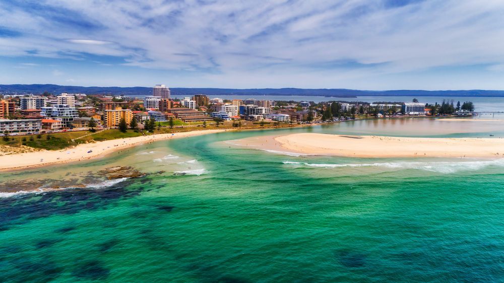 An Aerial View of a Beach With a City in the Background — SOAKD Exterior Cleaning in Tuggerah, NSW