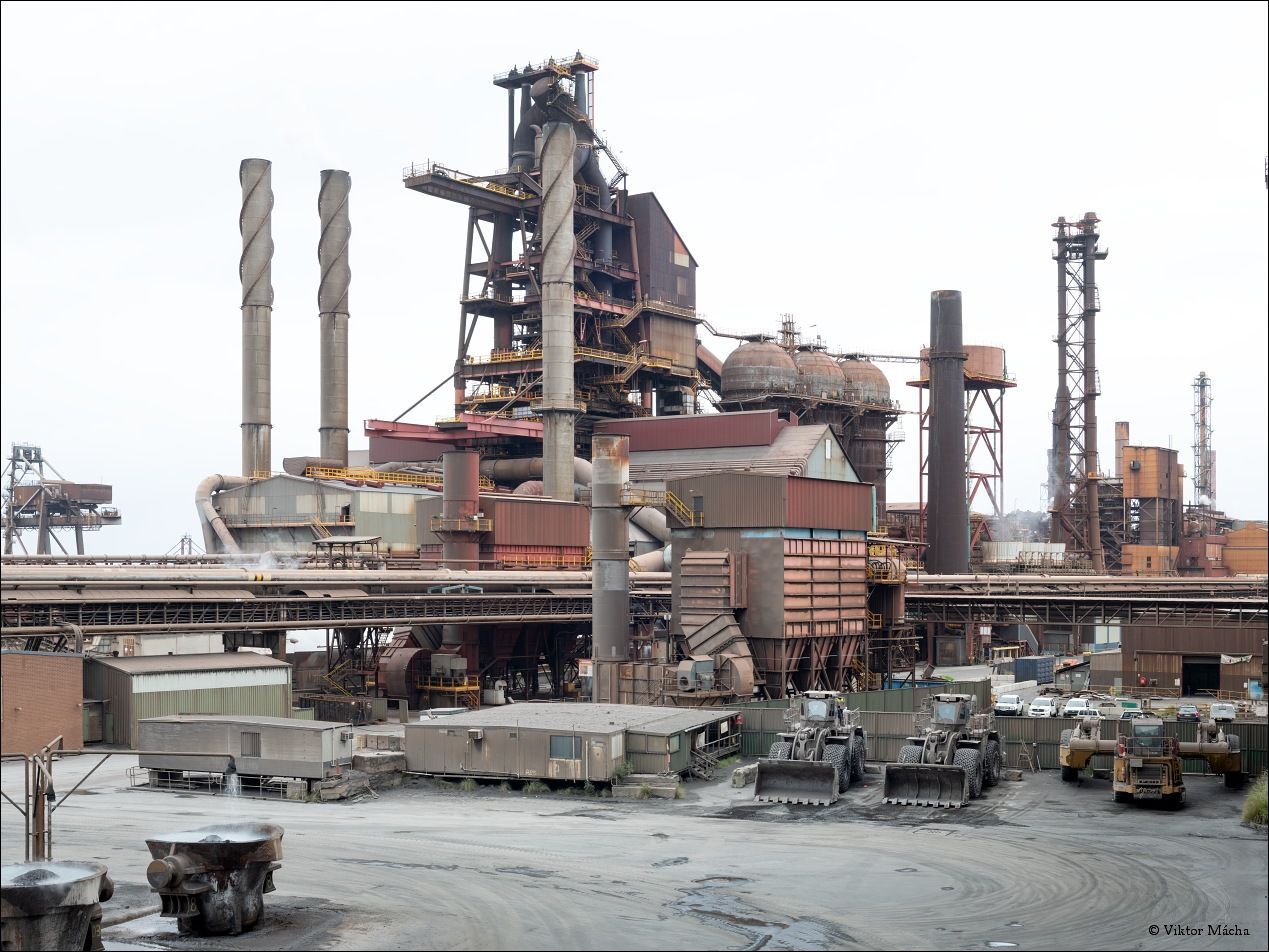 a large factory with a lot of machinery in front of it