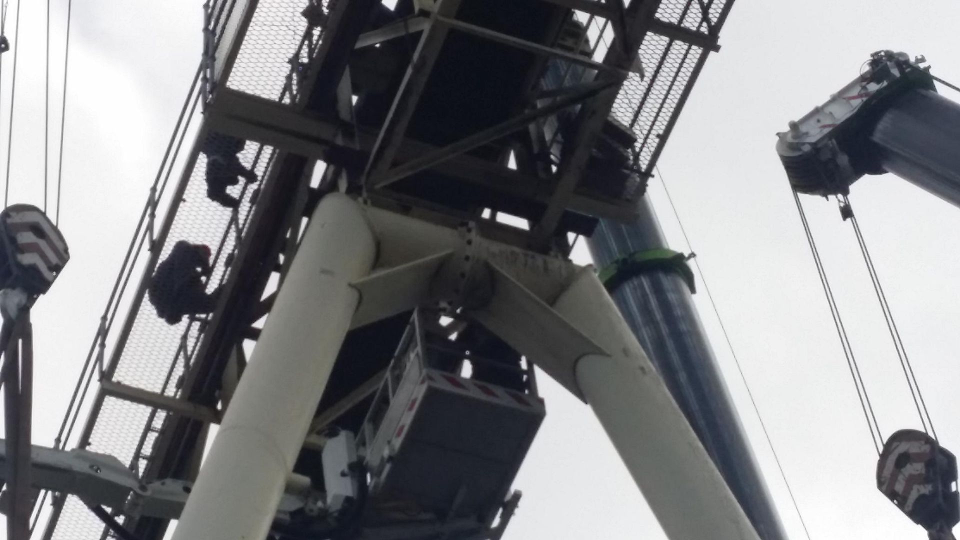 a large crane is being used to lift a large object