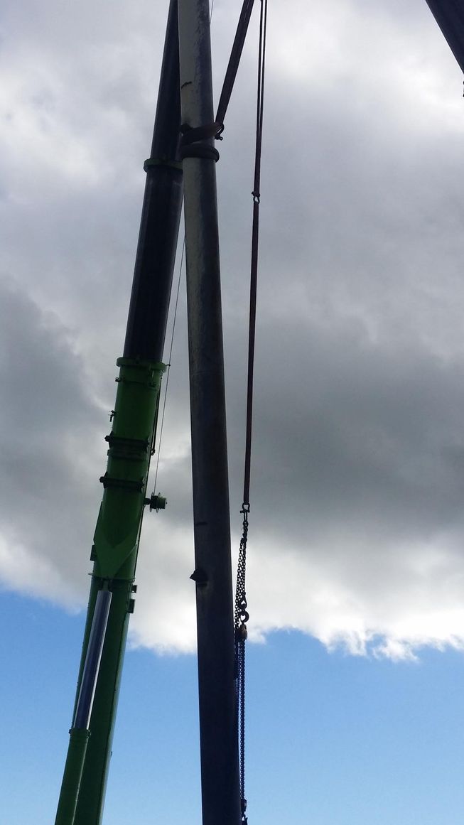 a very tall pole with a blue sky in the background