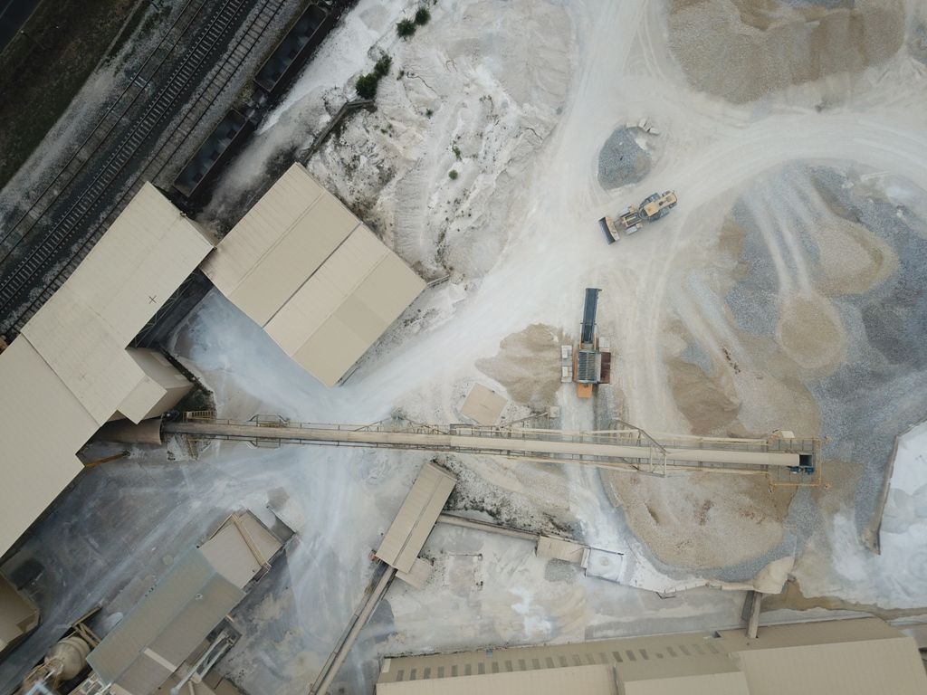 an aerial view of an industrial site with a few buildings