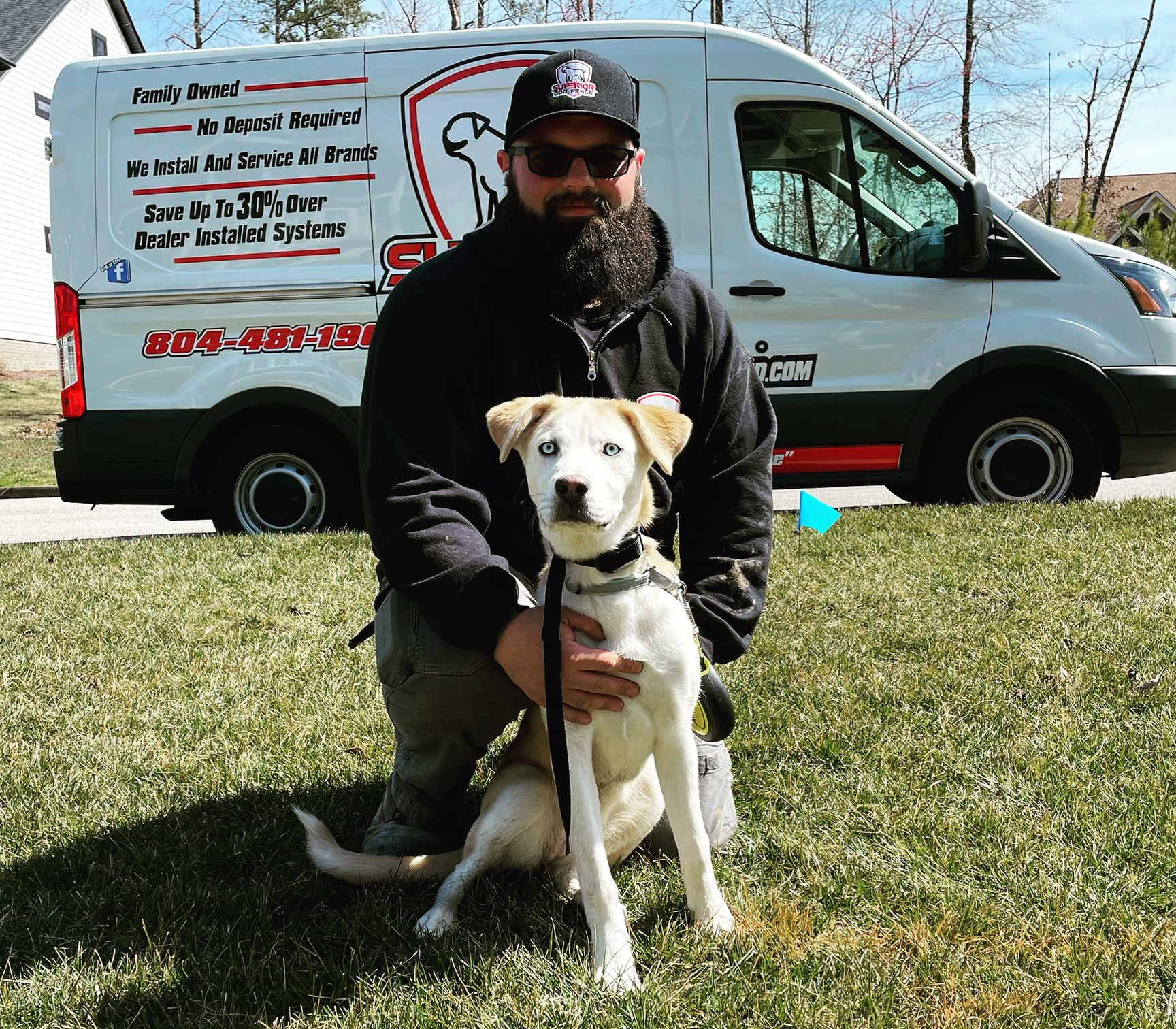 A man and a dog are looking at each other and the dog is licking the man 's face.