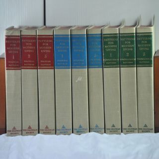 A row of books are lined up in a row