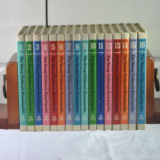 The young children 's encyclopedias are lined up in a row