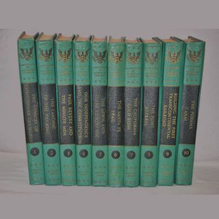 A row of books are lined up in a row