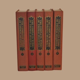 The complete works of thomas shadowell are lined up in a row