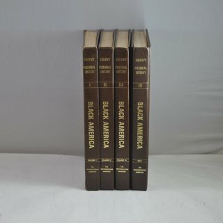 Four books titled black america are lined up on a table