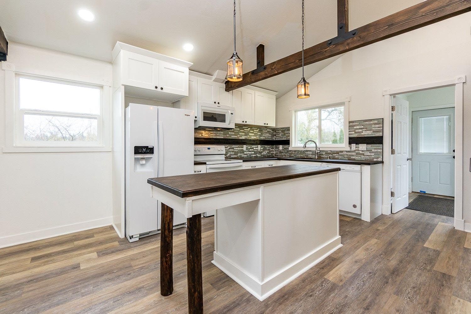 There is a large island in the middle of the kitchen.