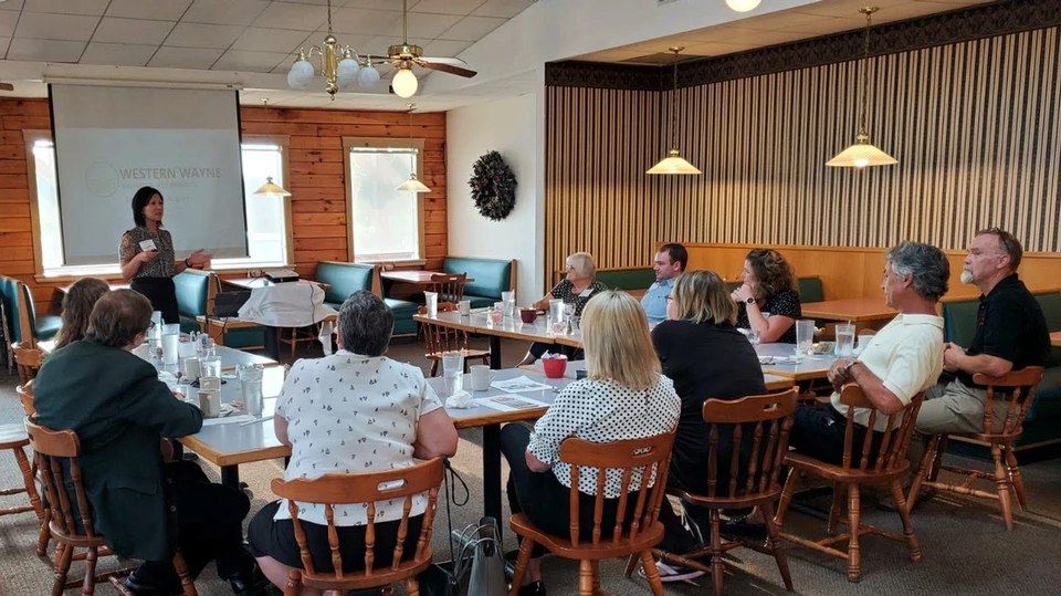 A general meeting for members inside Log Cabin Restaurant