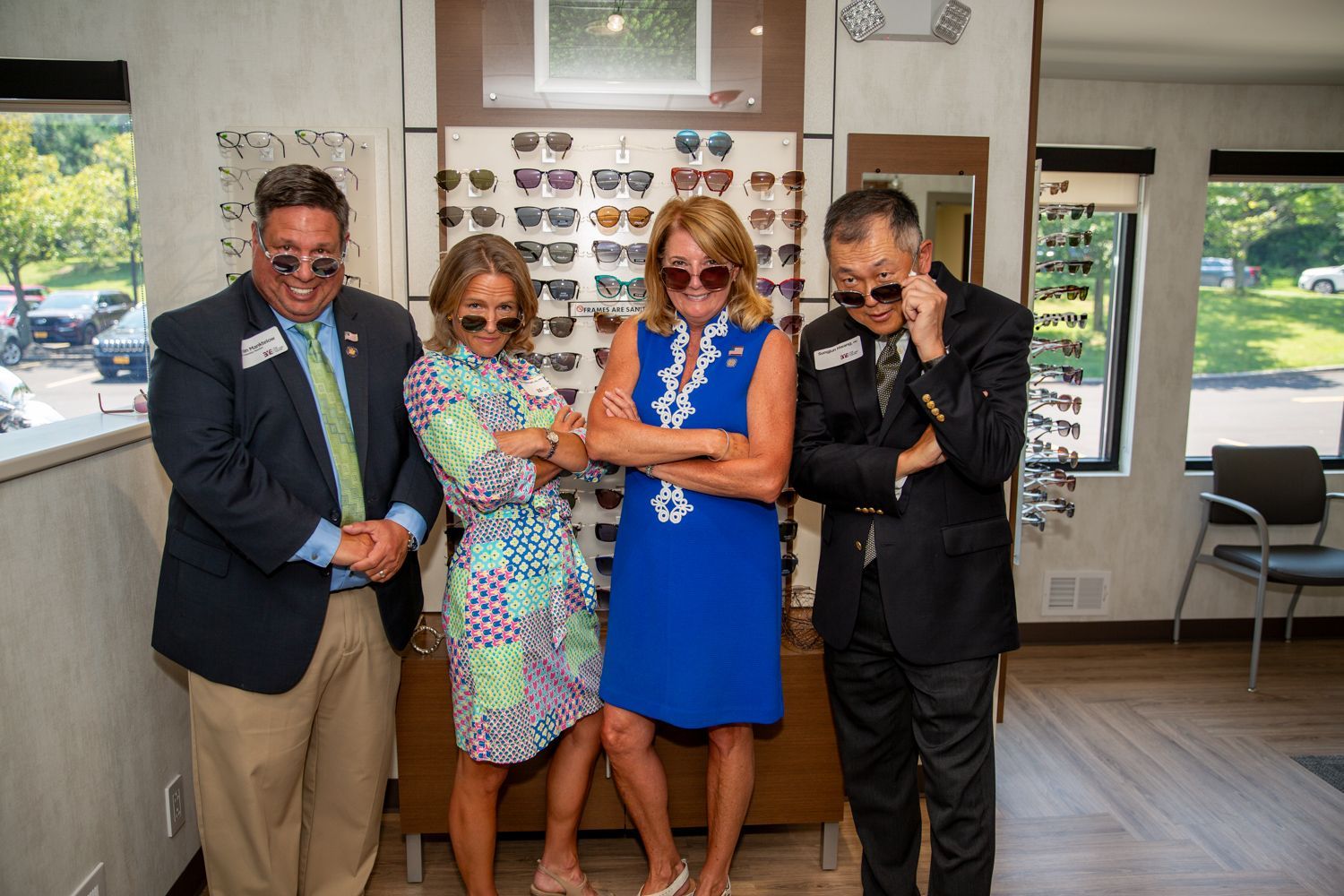 doctors, optometrists, and Senator Pamela Helming trying on eyeglasses