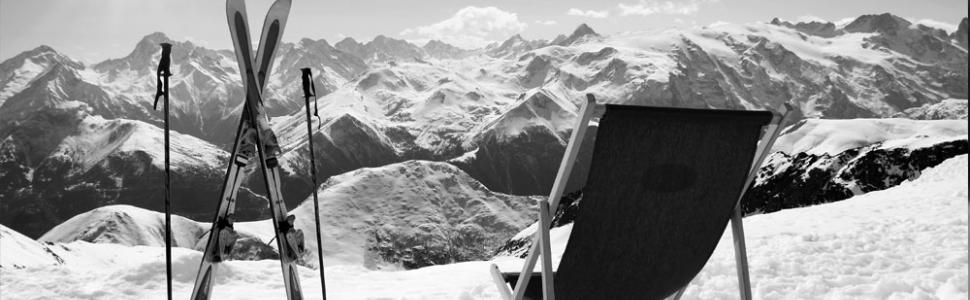 Chair and Skis Looking Over Mountain Range