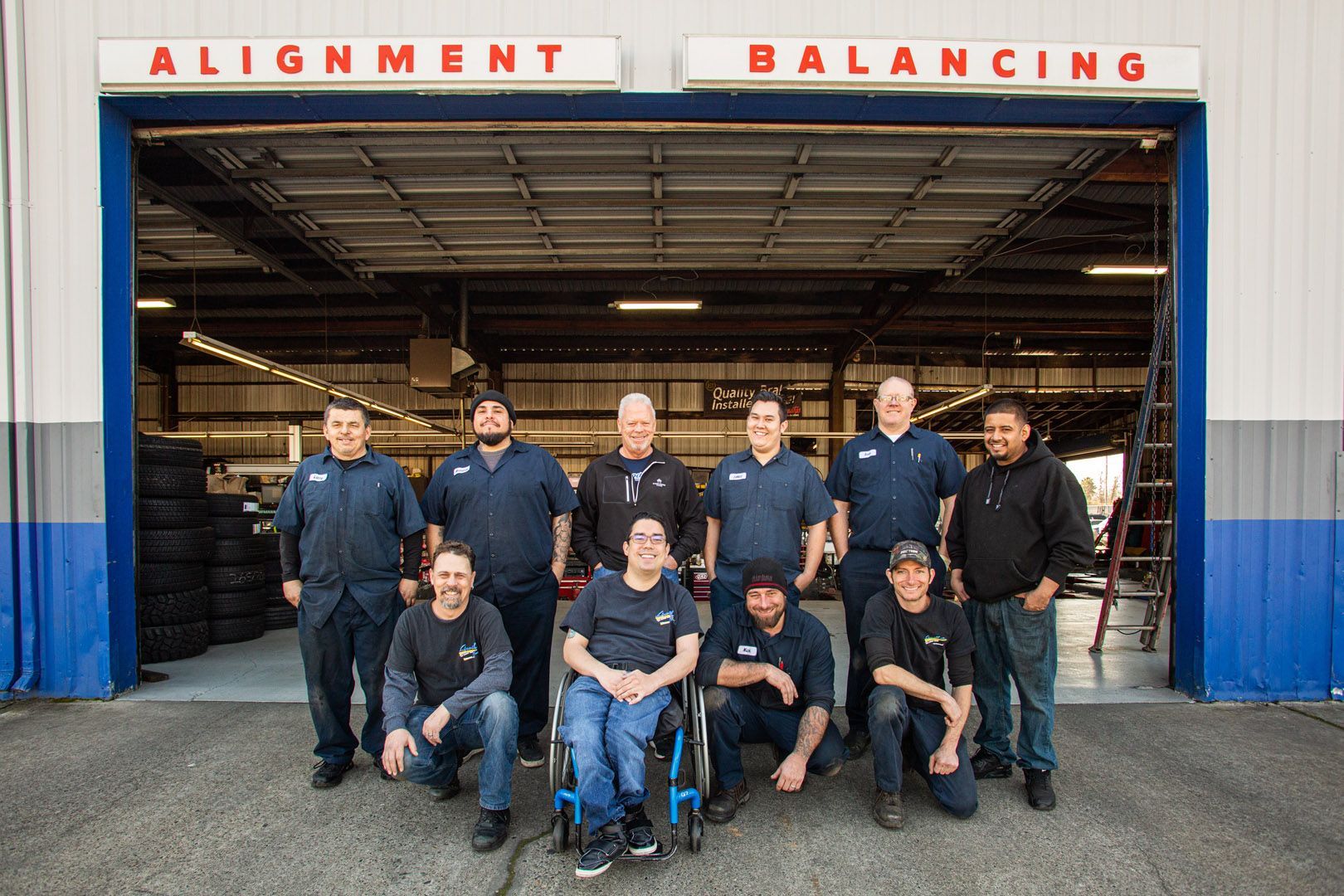 Team Photo In Front Of Alignment And Balancing Shop | Linville Brothers