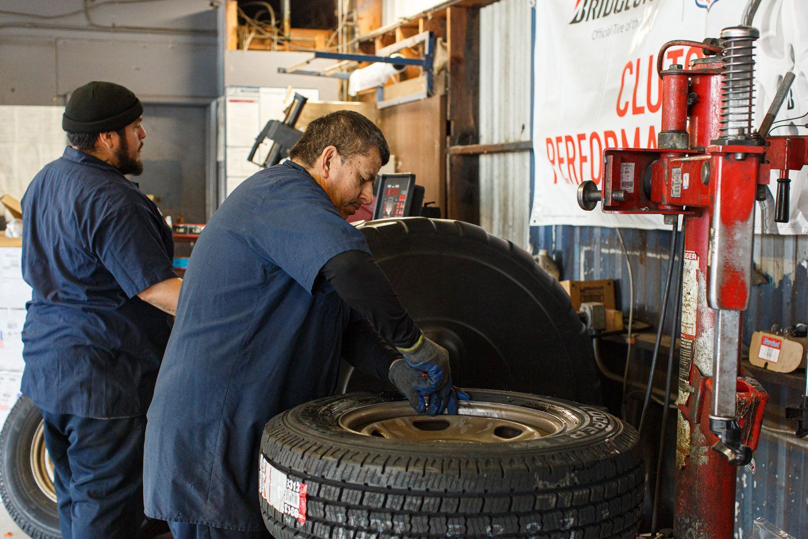 Technicians Working On Tire And Wheel Service In Shop | Linville Brothers