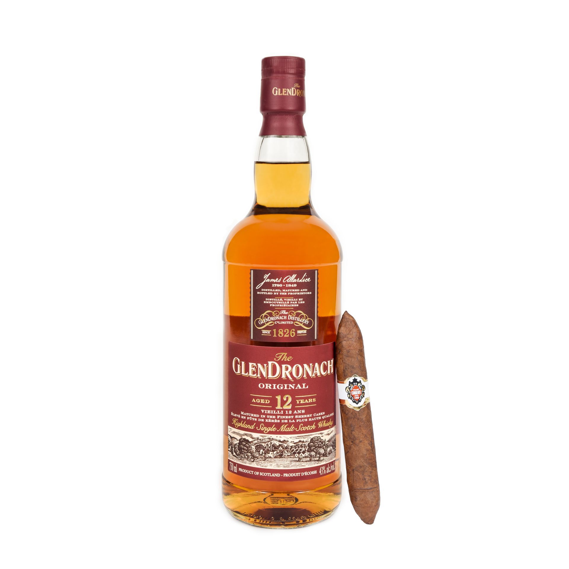 Bottle of GlenDronach 12-year-old whisky with a cigar, showcasing the amber liquid and red label.