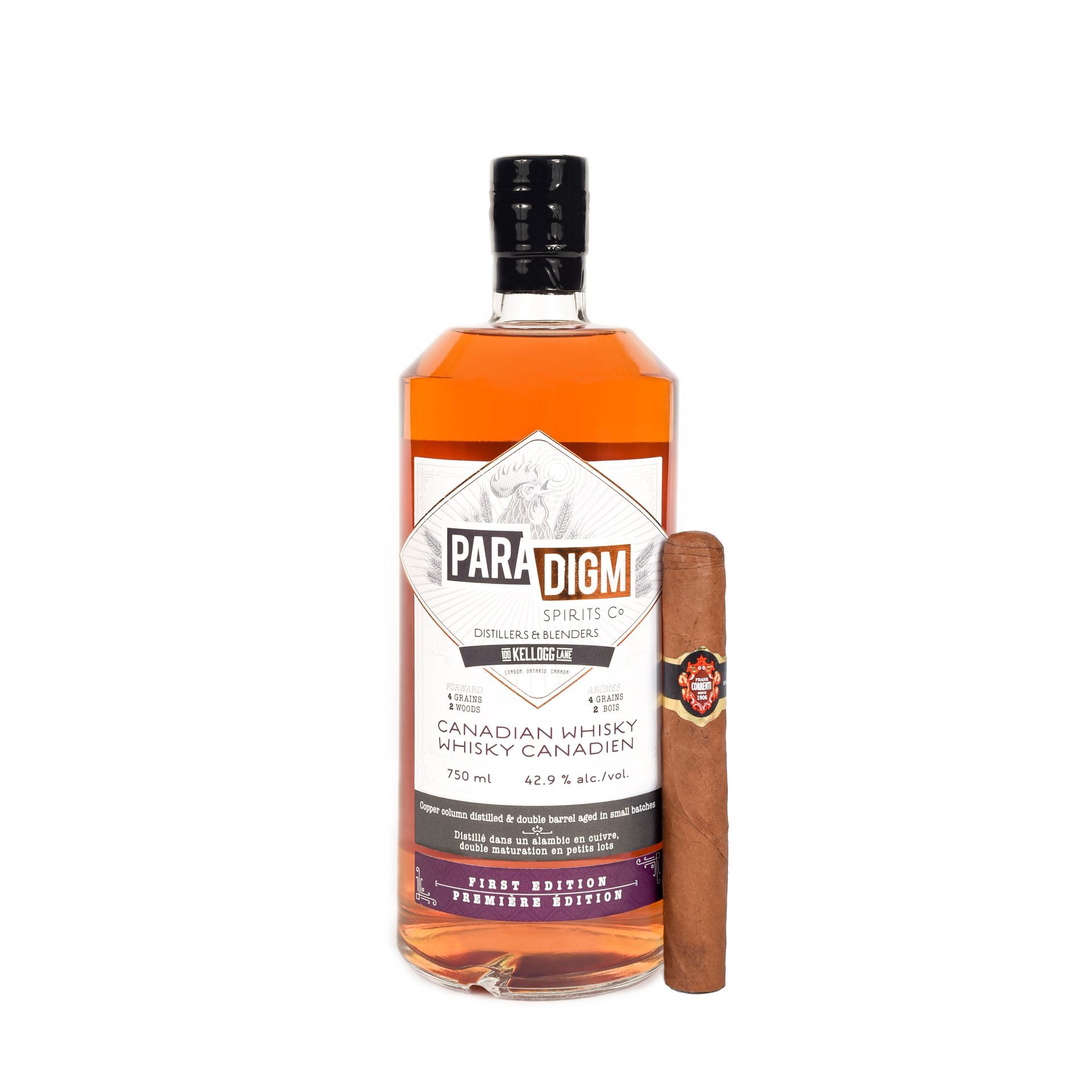 Bottle of Paradigm whiskey next to a cigar, on a white background.