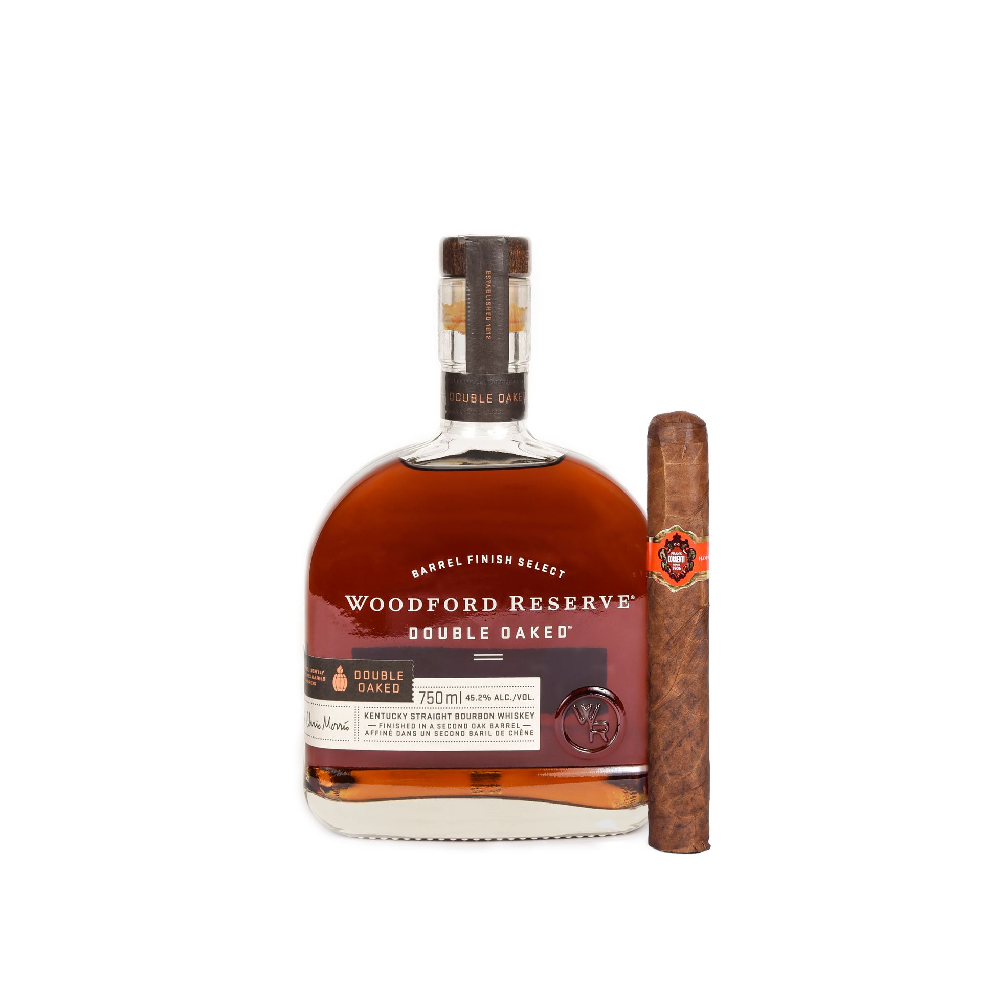 Woodford Reserve Double Oaked bourbon bottle next to a brown cigar.