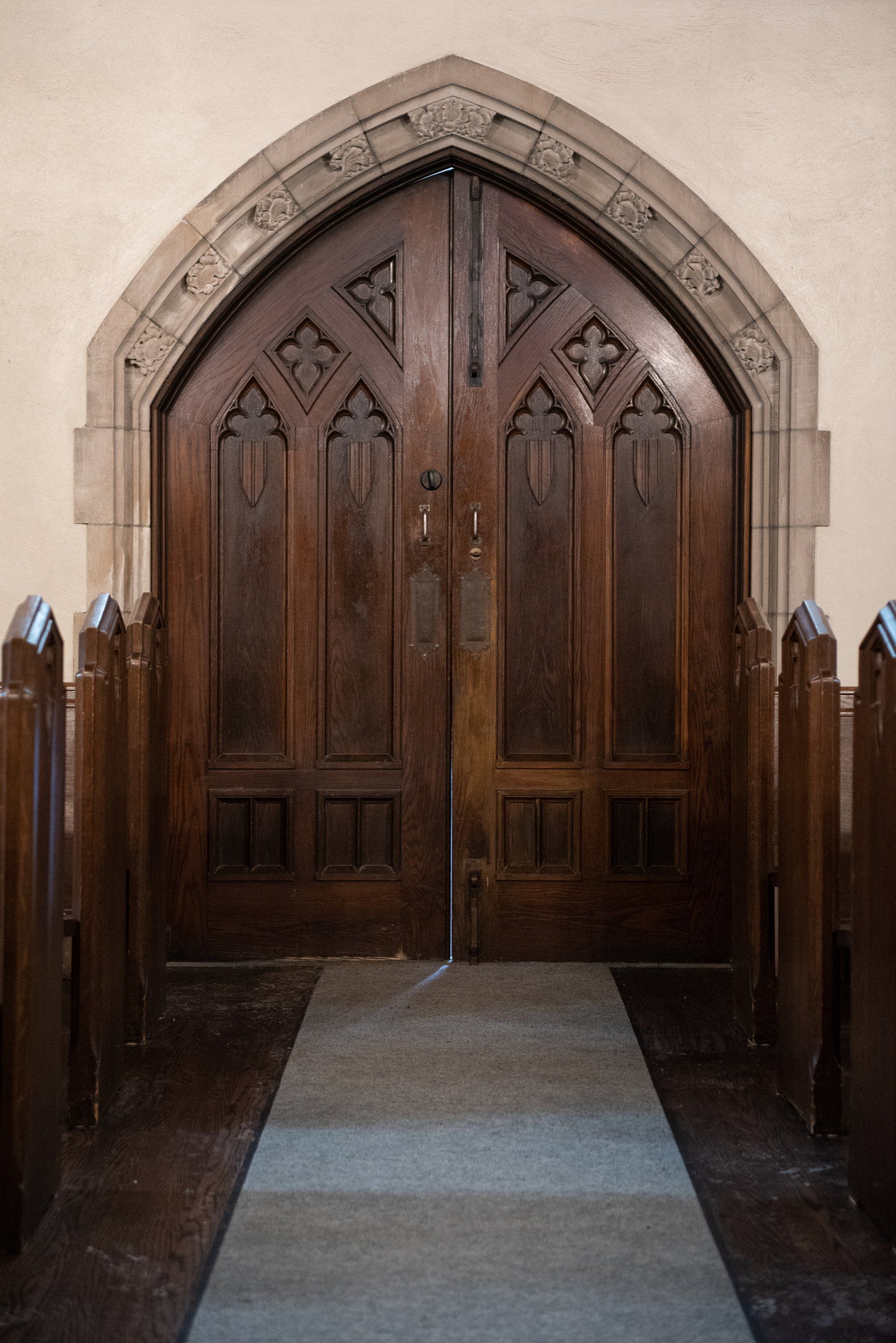 A wooden door in a church.