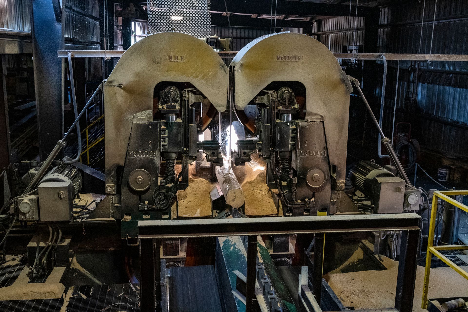 A man is working on a machine in a factory.