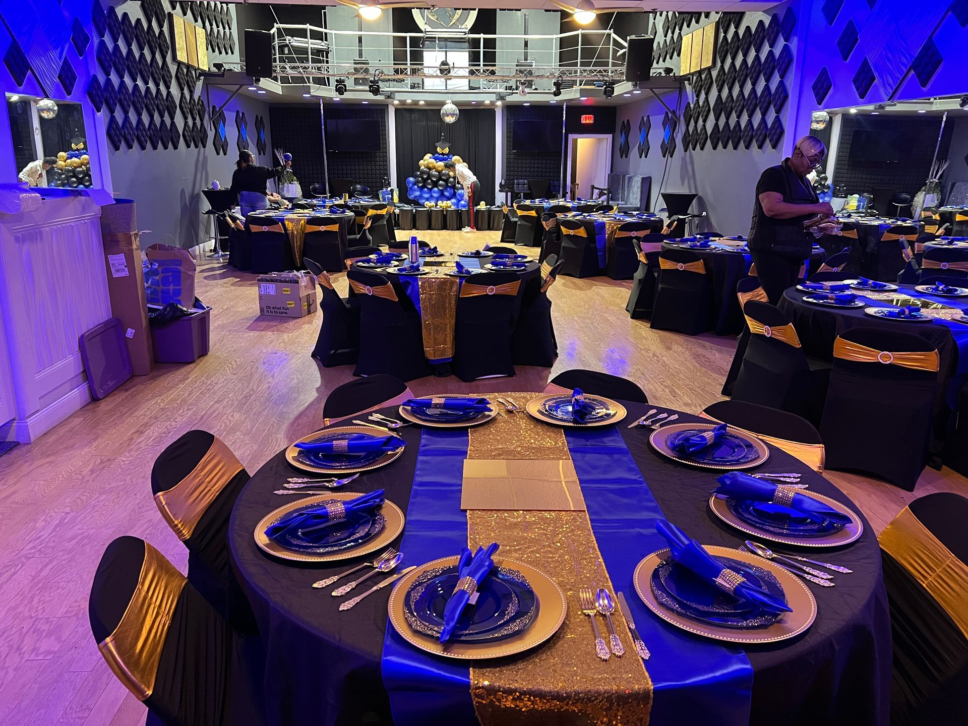 A microphone is sitting on top of a mixer in front of a computer.