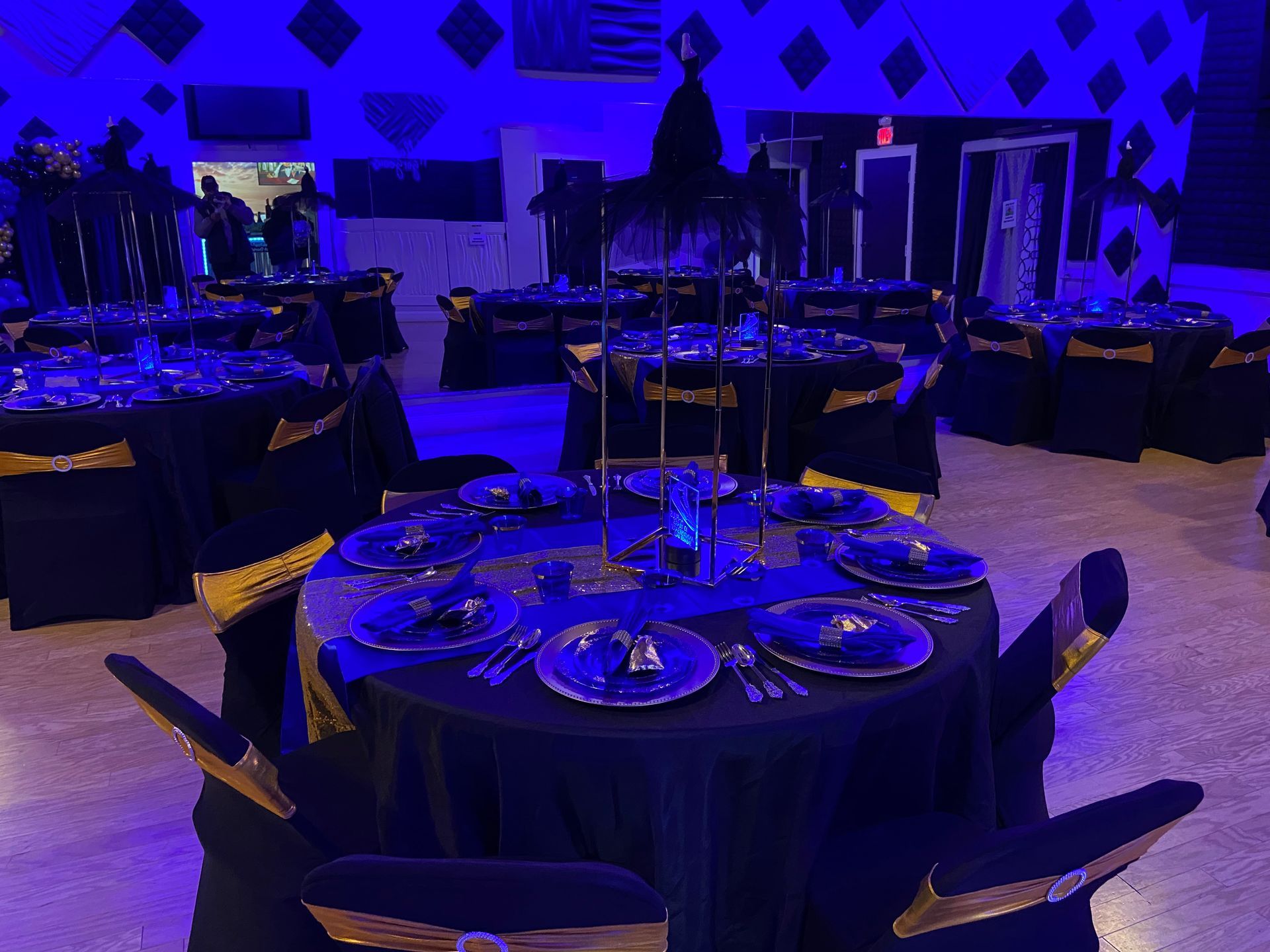 A room filled with tables and chairs set up for a party.