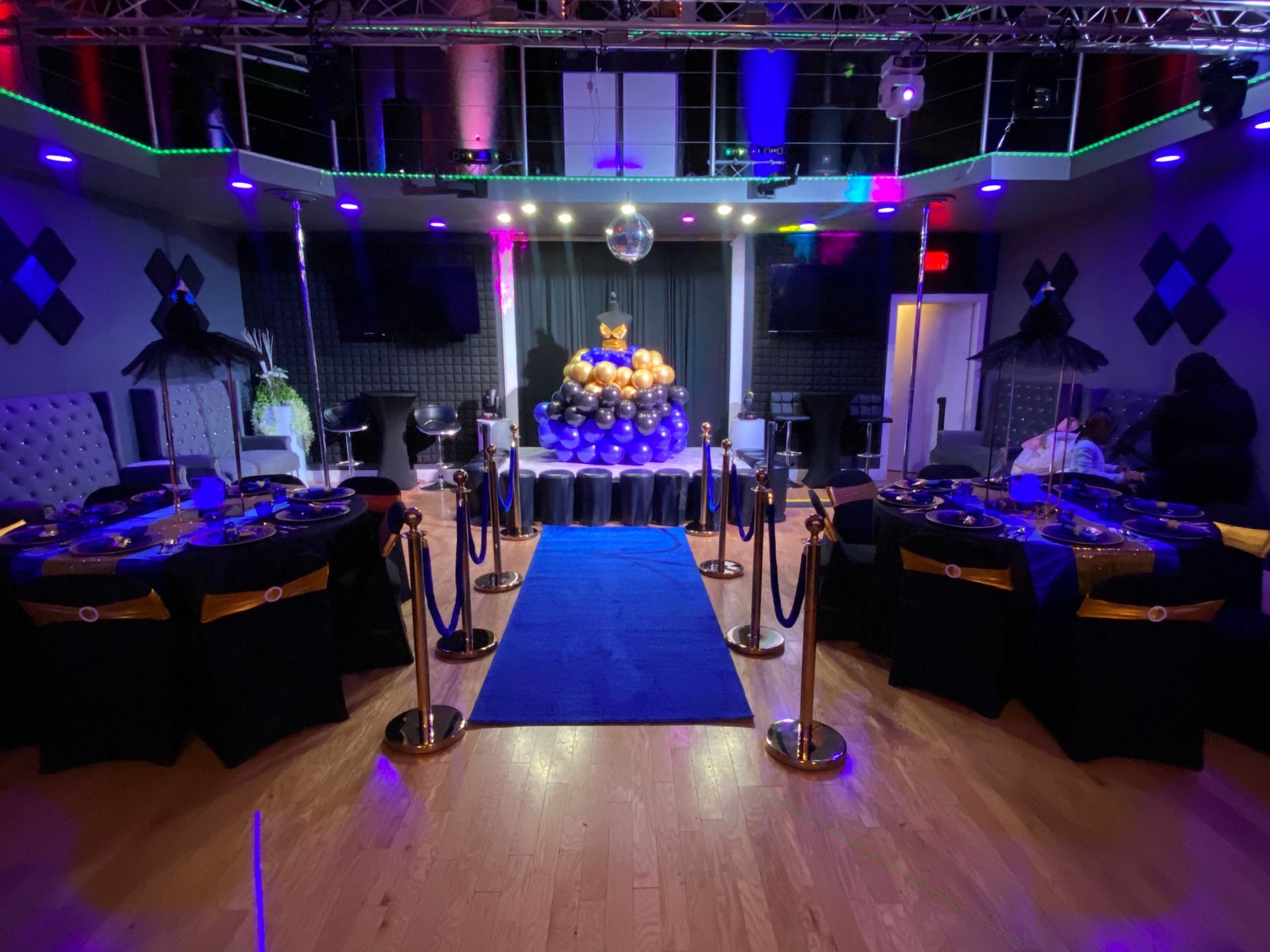 A woman is sitting at a table holding a piece of paper during a job interview.