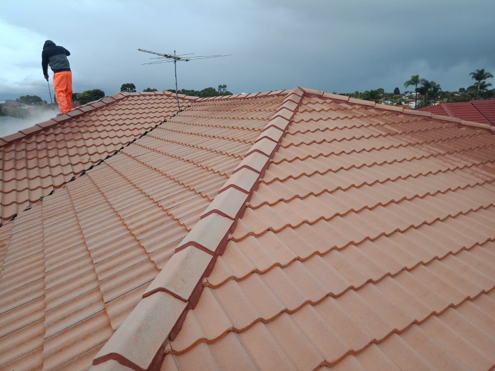 Worker Using Pressure Washer — Thornlie, WA — Noble Roof Restoration & Repairs