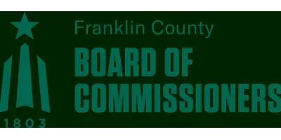 Franklin County Board of Commissioners logo in green with stylized monument and star