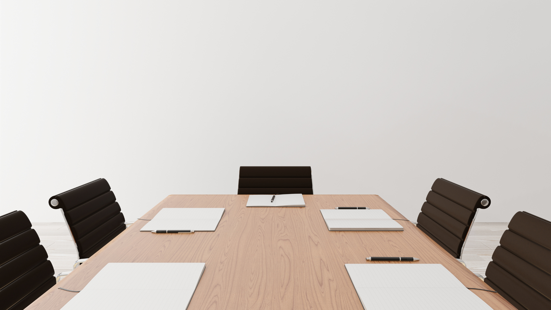 A conference room with a wooden table and chairs and a whiteboard on the wall.