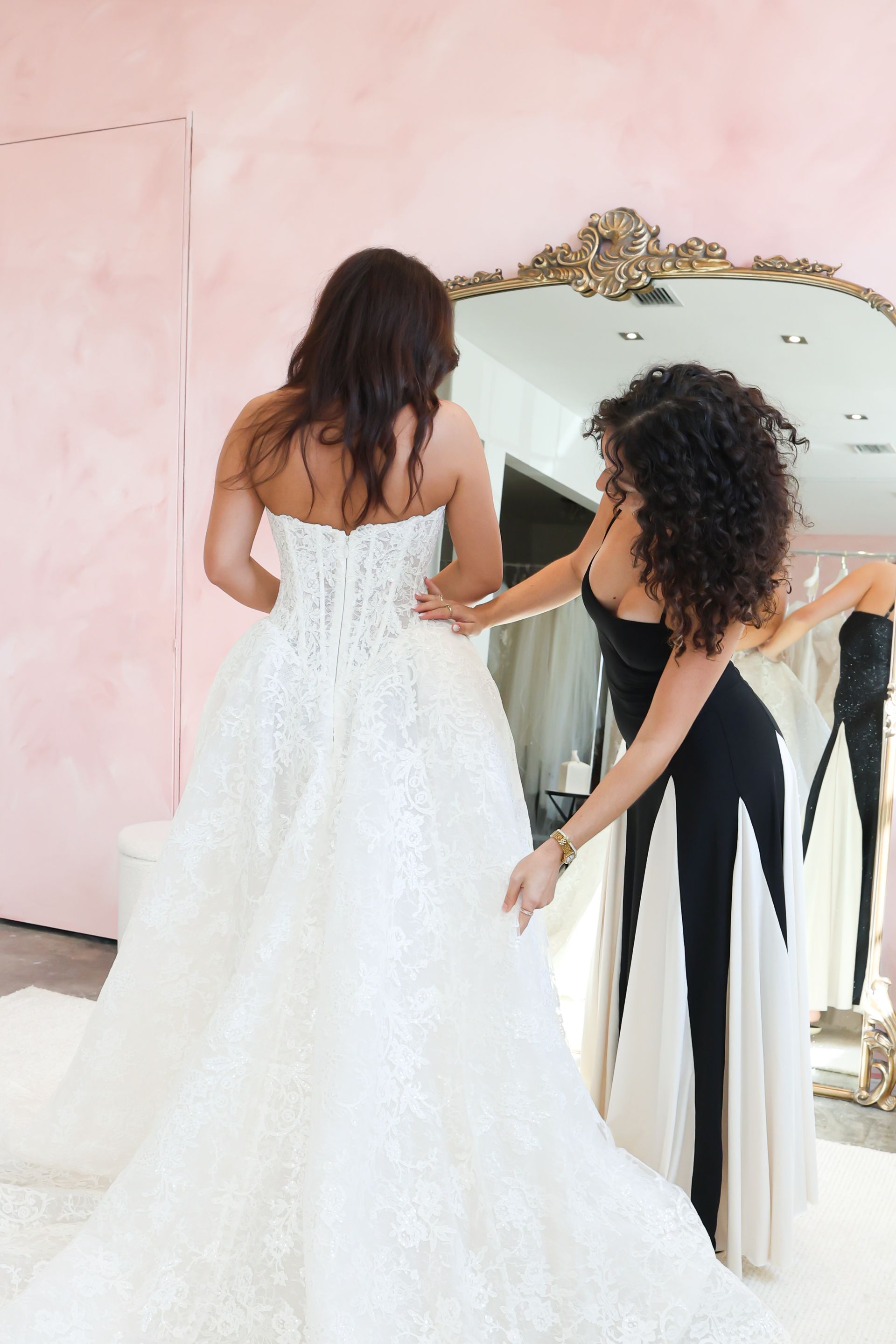 A bride is holding a bouquet of white roses