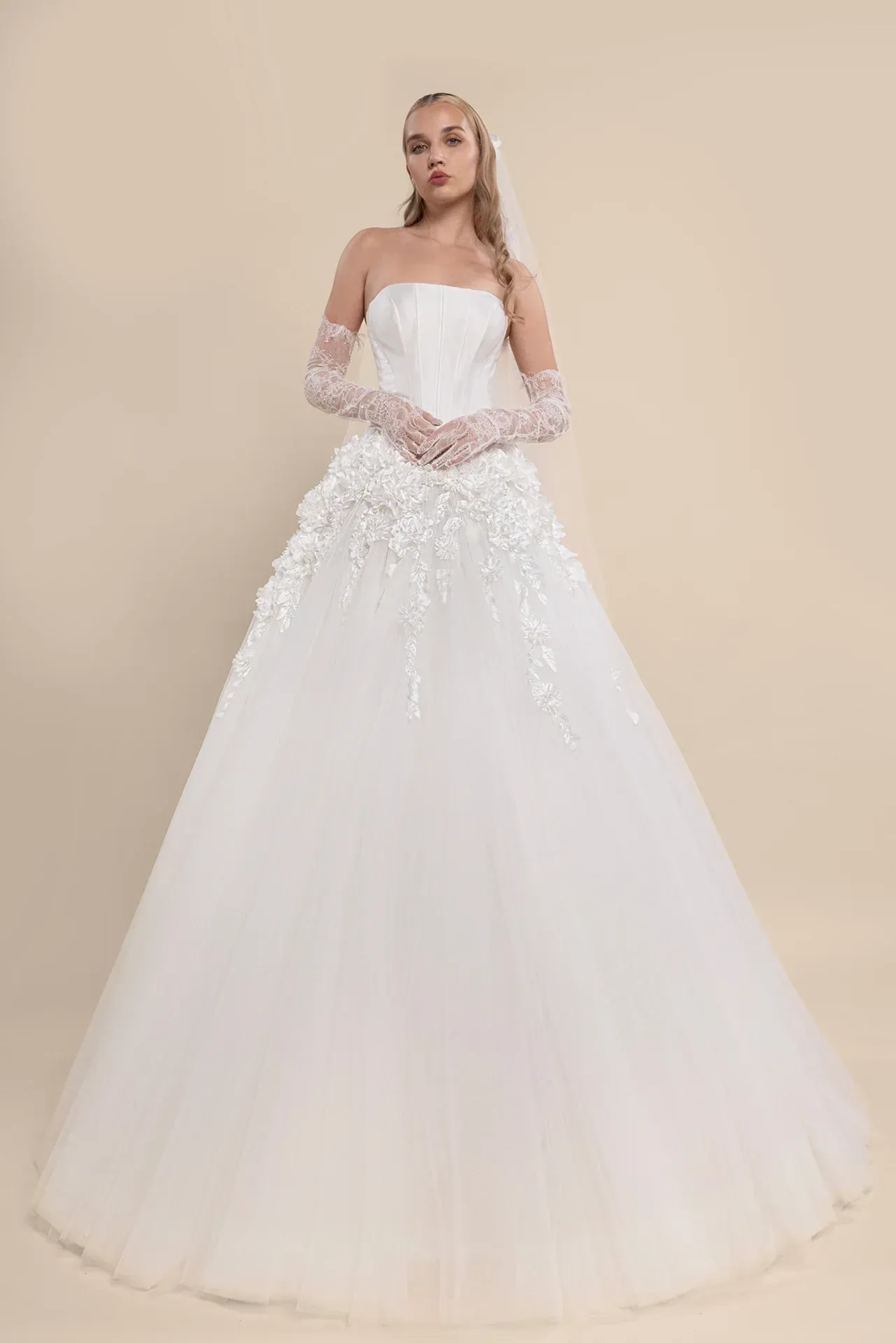 A black and white photo of a woman in a wedding dress.