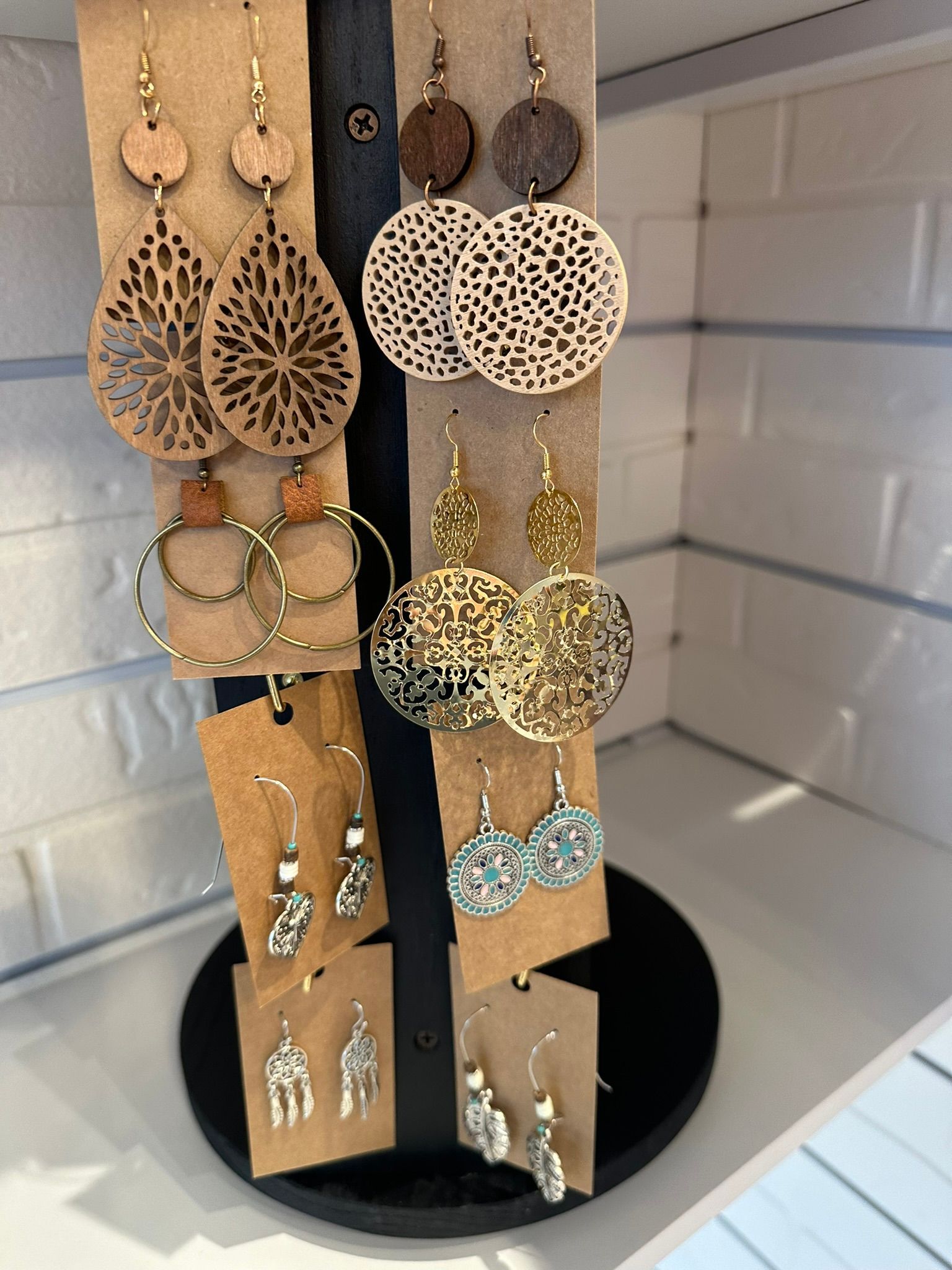 Browse beautiful earrings for purchase in-store at Elite Tanning & Spa