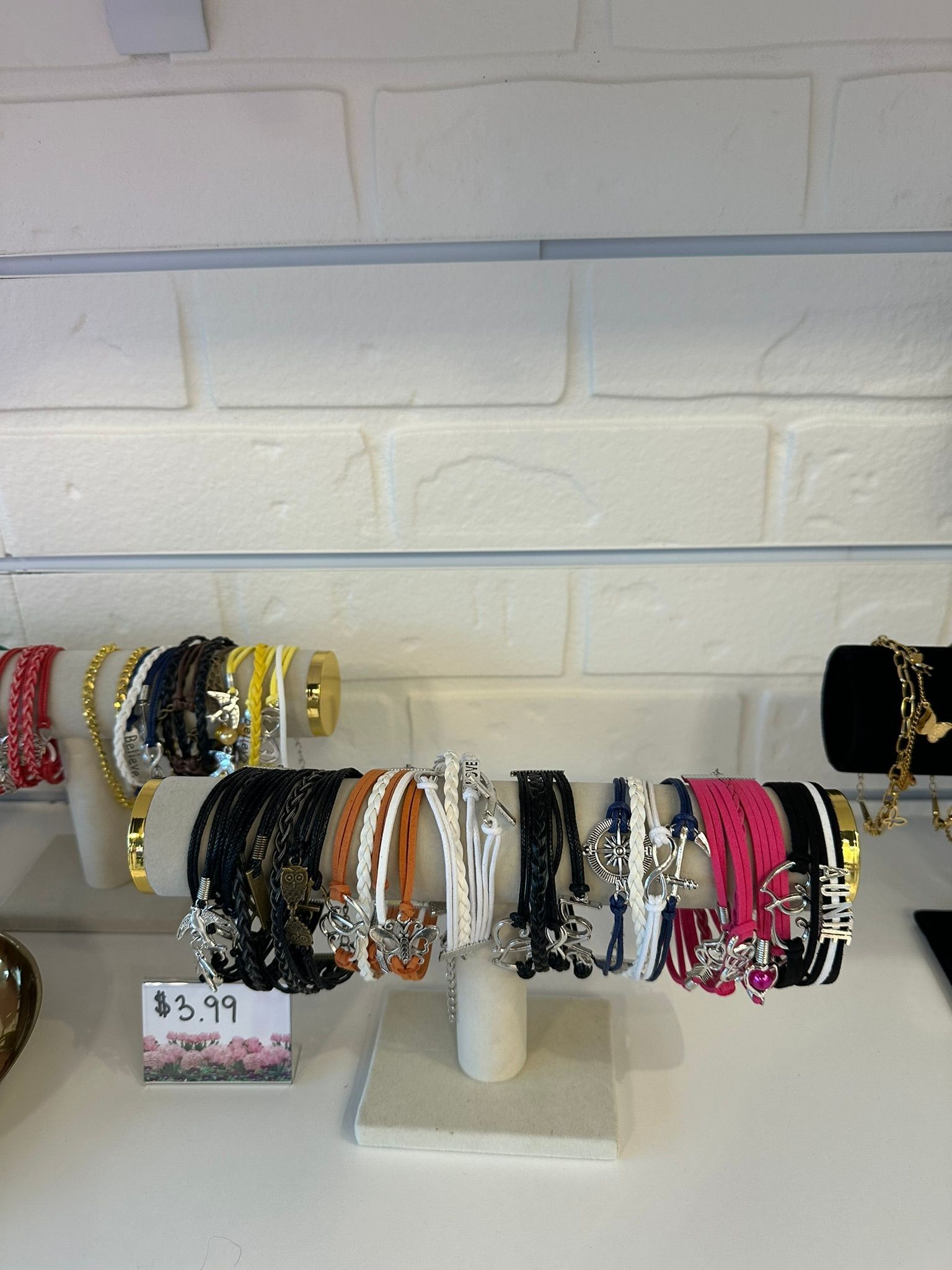 A display of bracelets with a price tag of $ 5.99 at Elite Tanning & Spa