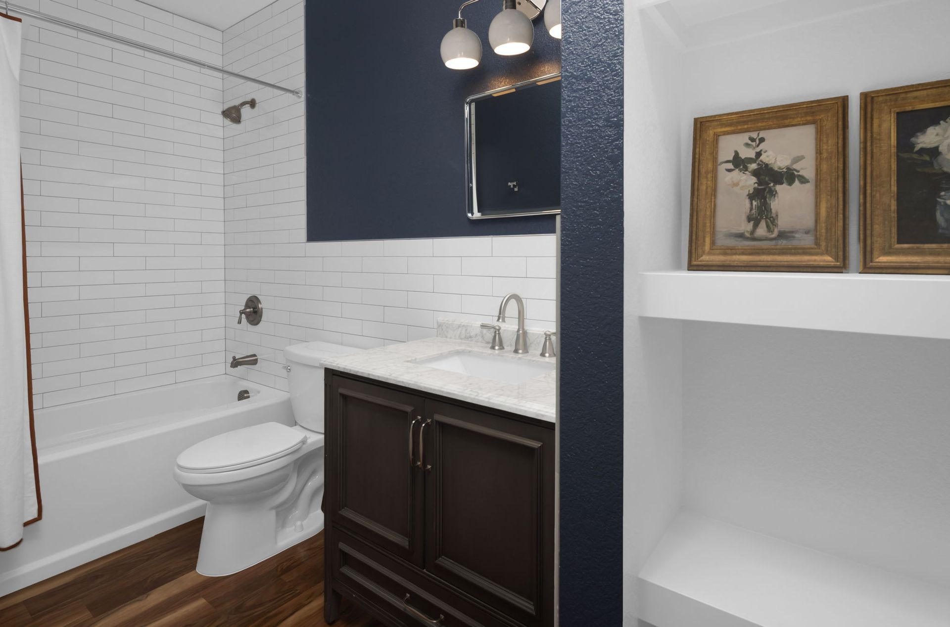 A patio with a table and chairs under an umbrella