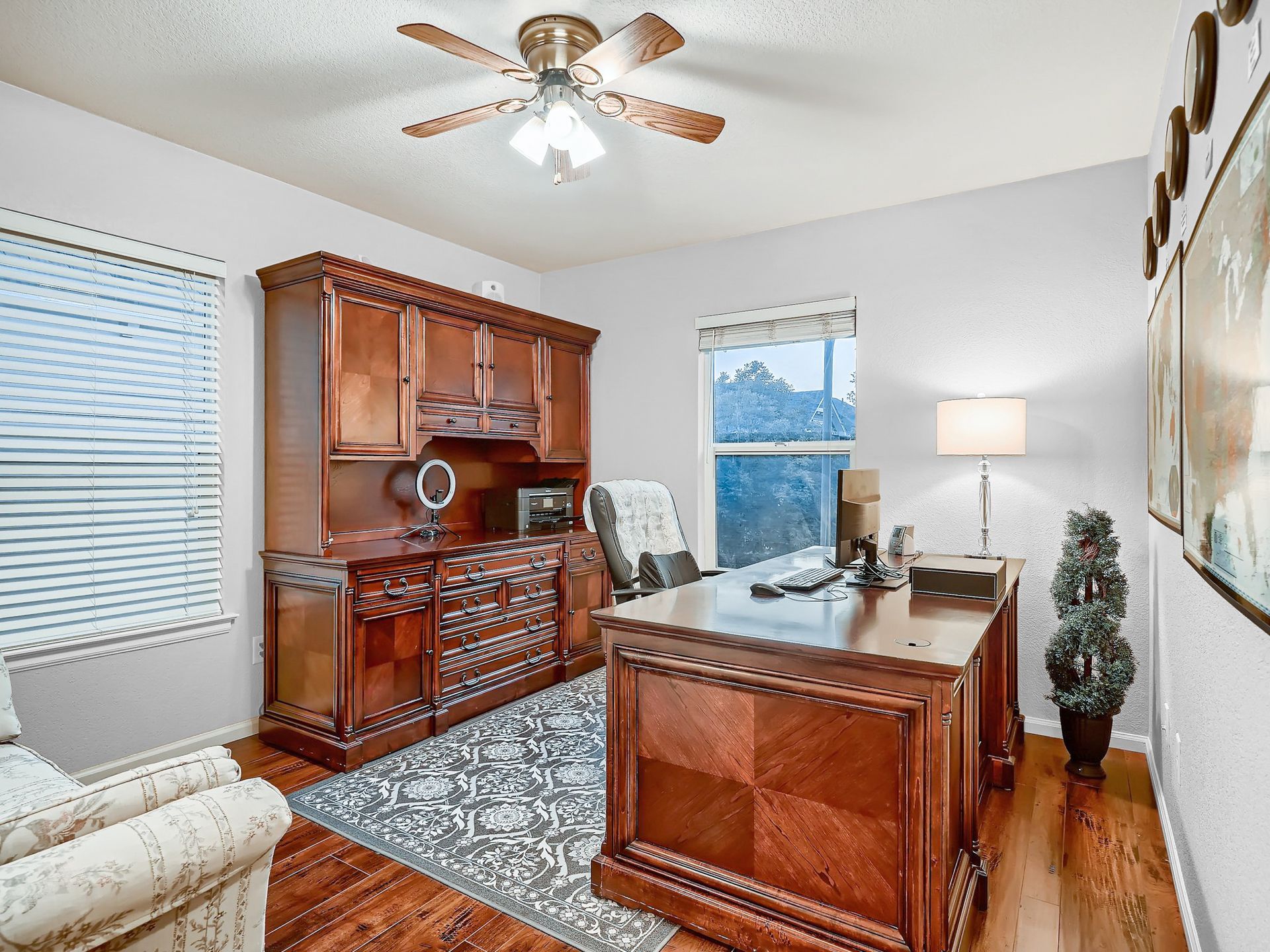 A living room with a fireplace and a flat screen tv