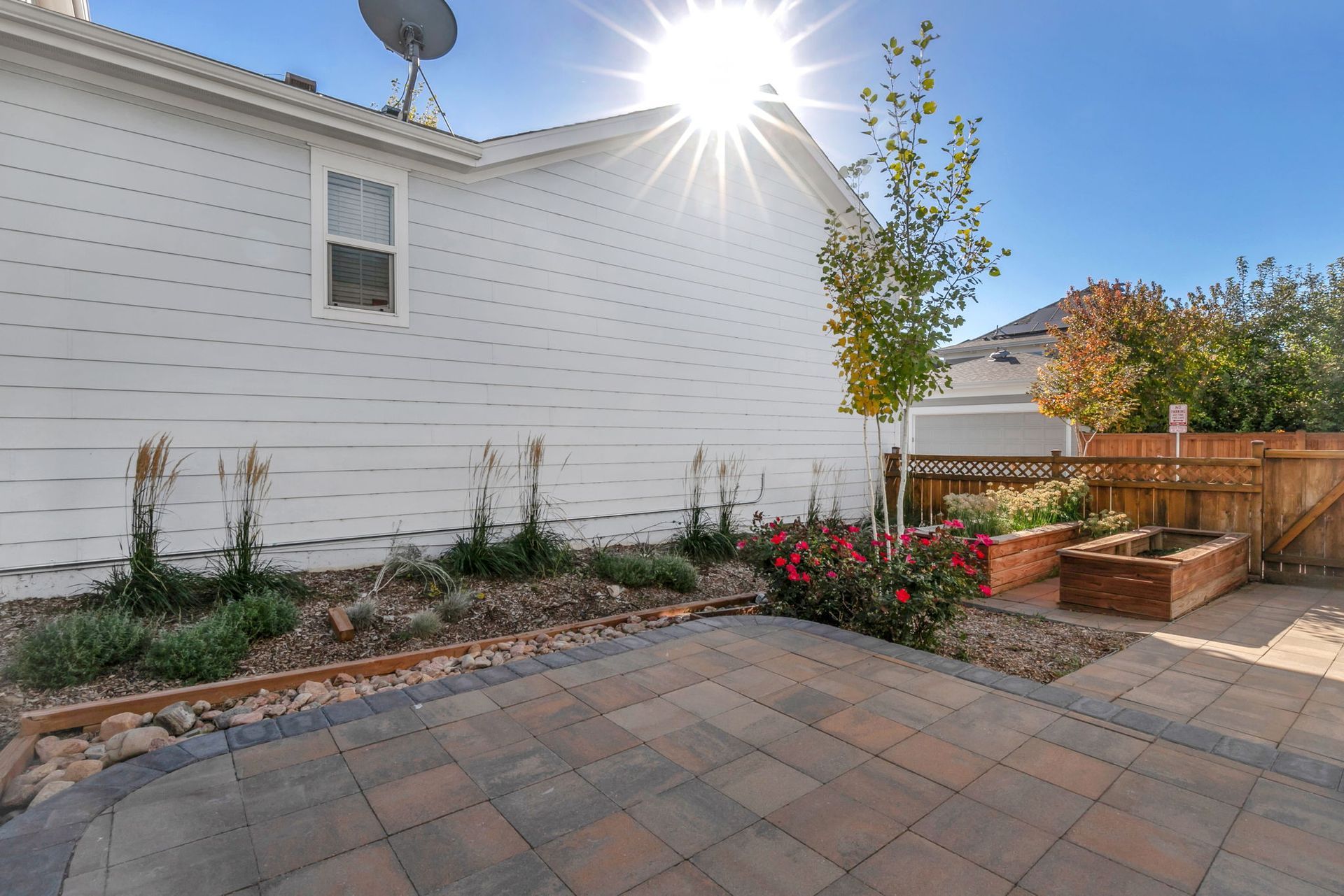 A kitchen with wooden cabinets , granite counter tops , stainless steel appliances and a large island.