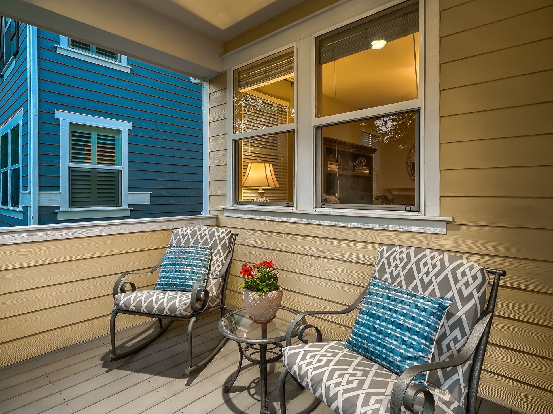 The front of a house with a porch and stairs leading up to it.