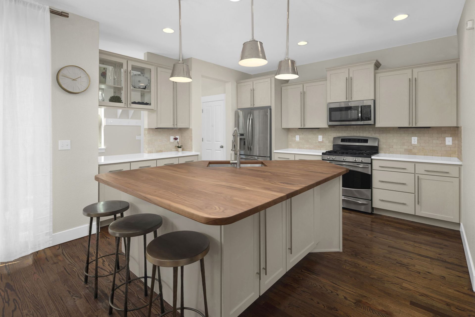 A living room with a sectional couch and a coffee table