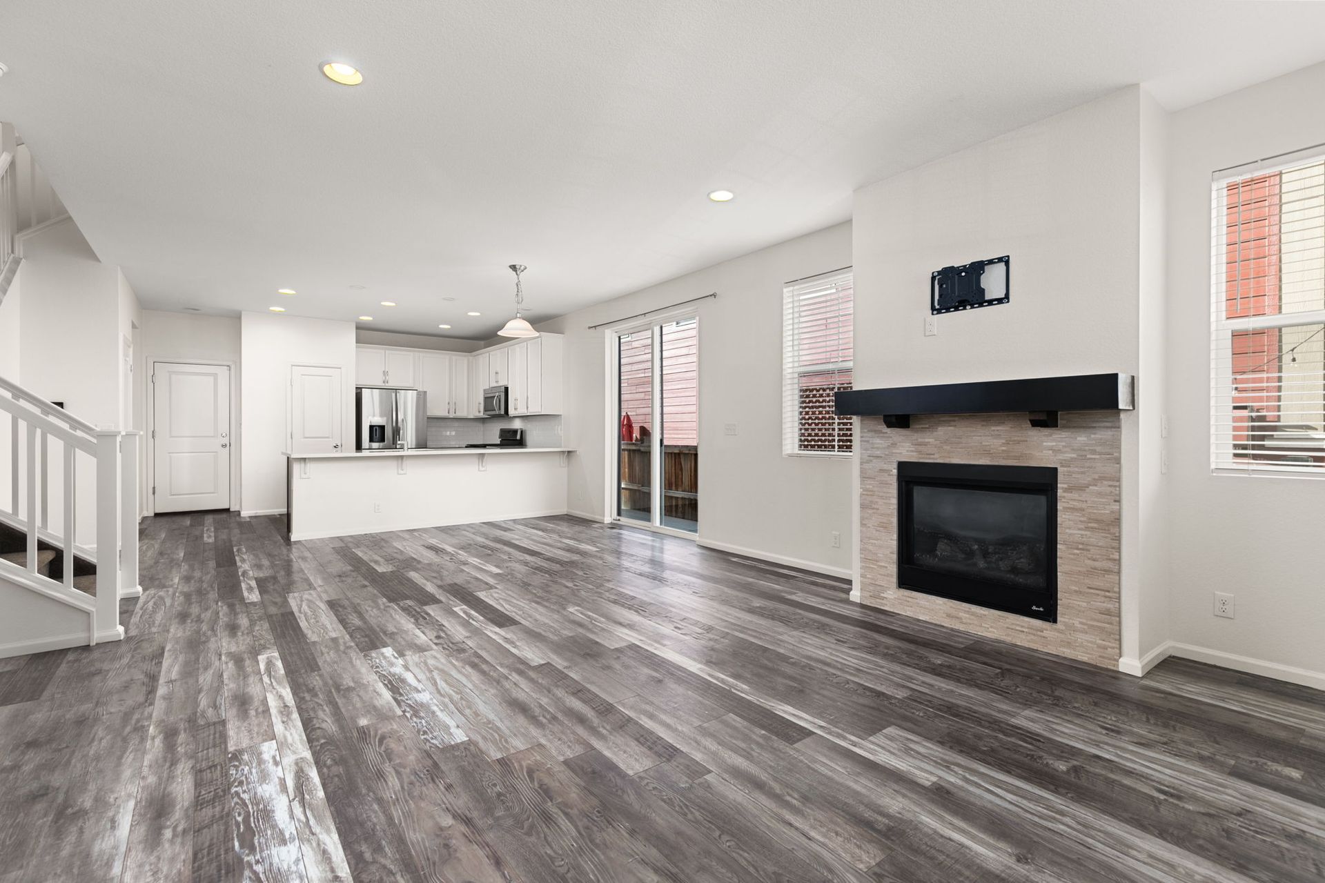 There is a fireplace in the middle of the living room.