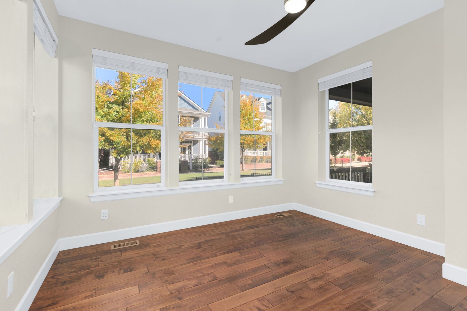 A bedroom with a large bed and a flat screen tv on the wall.