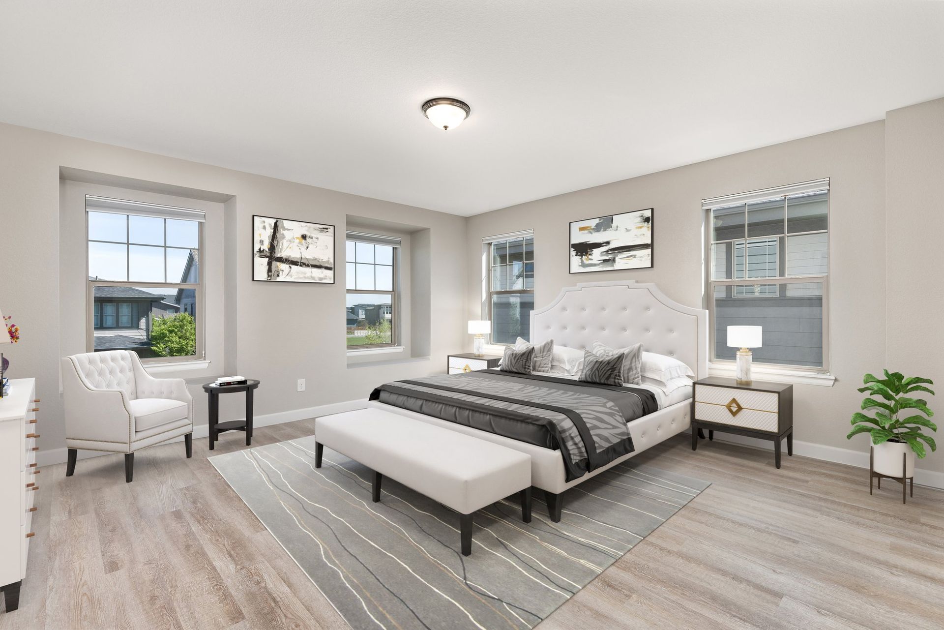 A house with a large porch is sitting on top of a lush green lawn.