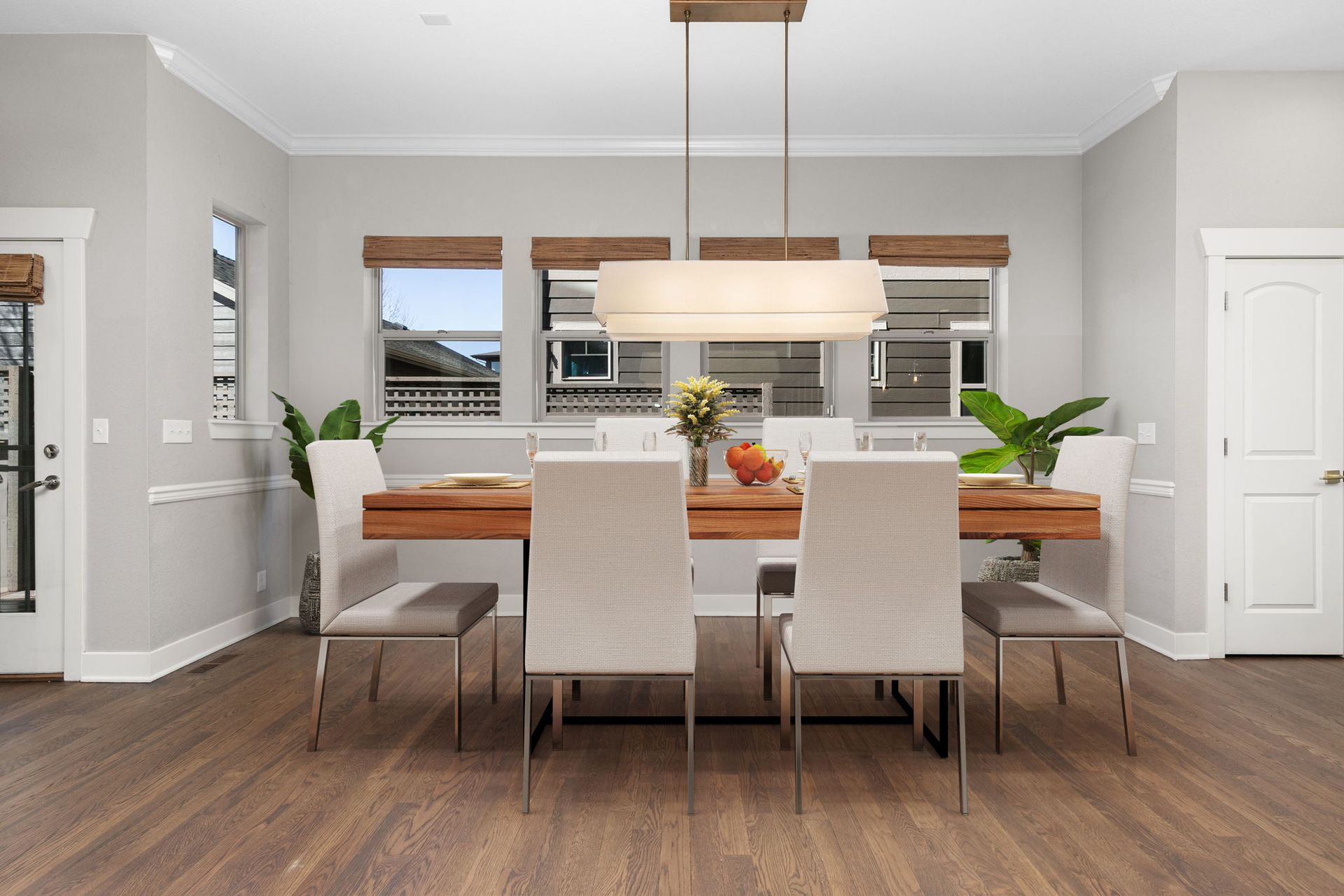 An empty room with hardwood floors and a window.