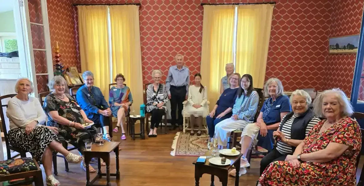 Friends and members enjoying delicious food at our Amelia Earhart Event