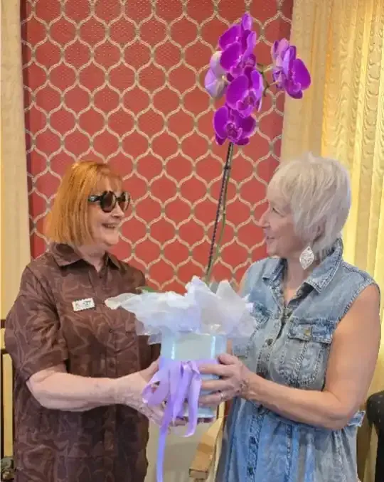 Our raffle winner receiving a beautiful orchid