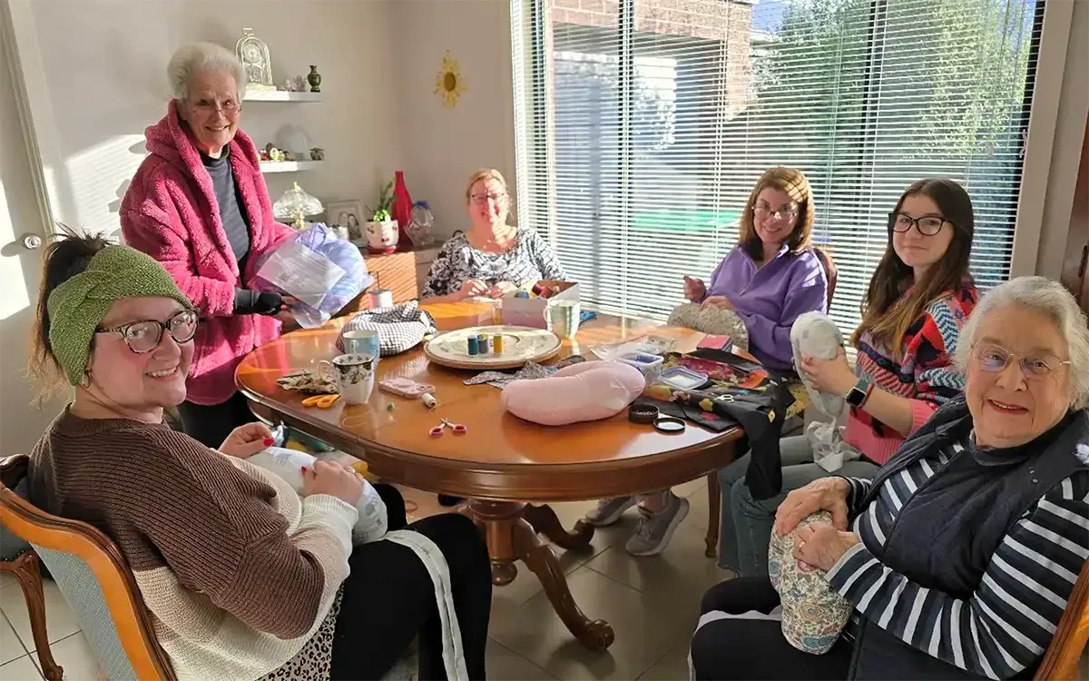 Zonta Club of Ballarat members and volunteers working on breast cushions