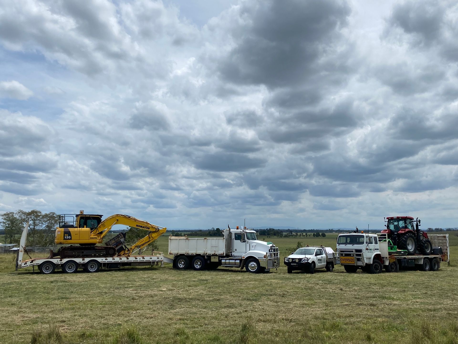 A Several Heavy-duty Vehicles Are Parked in a Grassy Field — PVM Contracting in Alstonville, NSW