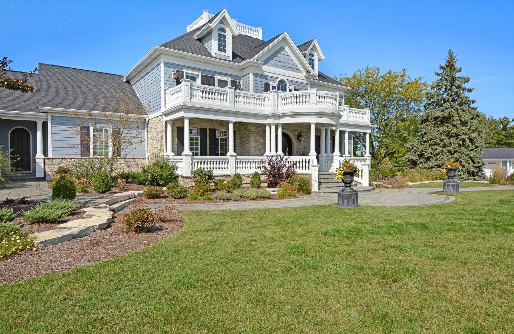 a large house with a large lawn in front of it